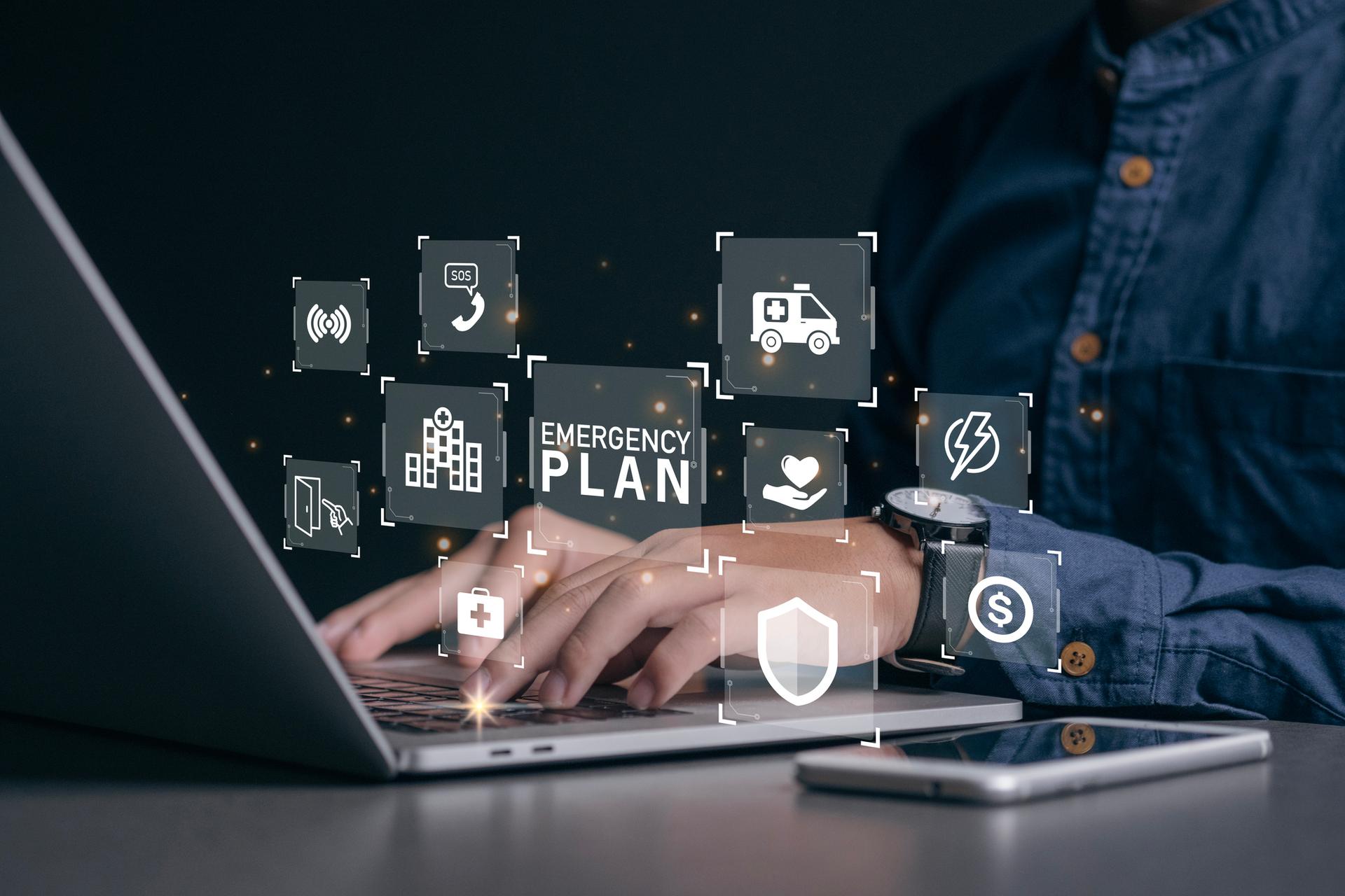 Man using a computer to Emergency Plan icon to learn and prepare in emergency situation